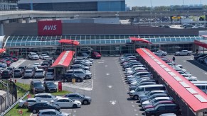 An Avis rental car parking lot is full because there were no customers during the COVID-19 pandemic at JFK Airport