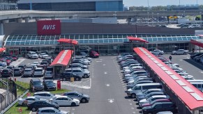 An Avis rental car parking lot is full because there were no customers during the COVID-19 pandemic at JFK Airport