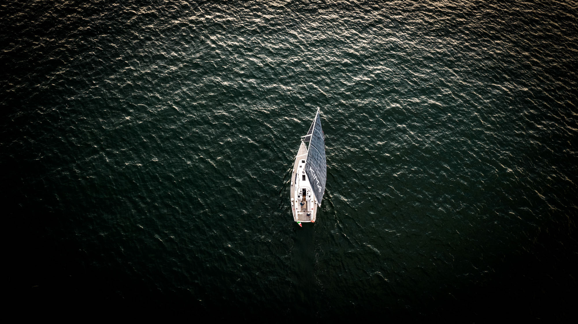 A drone view of a sailboat during the sunset in Sottomarina, Chioggia, Italy, on May 30, 2021