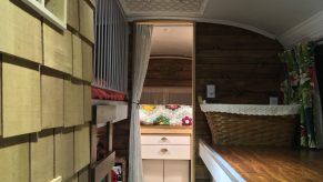 A view into the sleeping quearters of a converted school bus RV