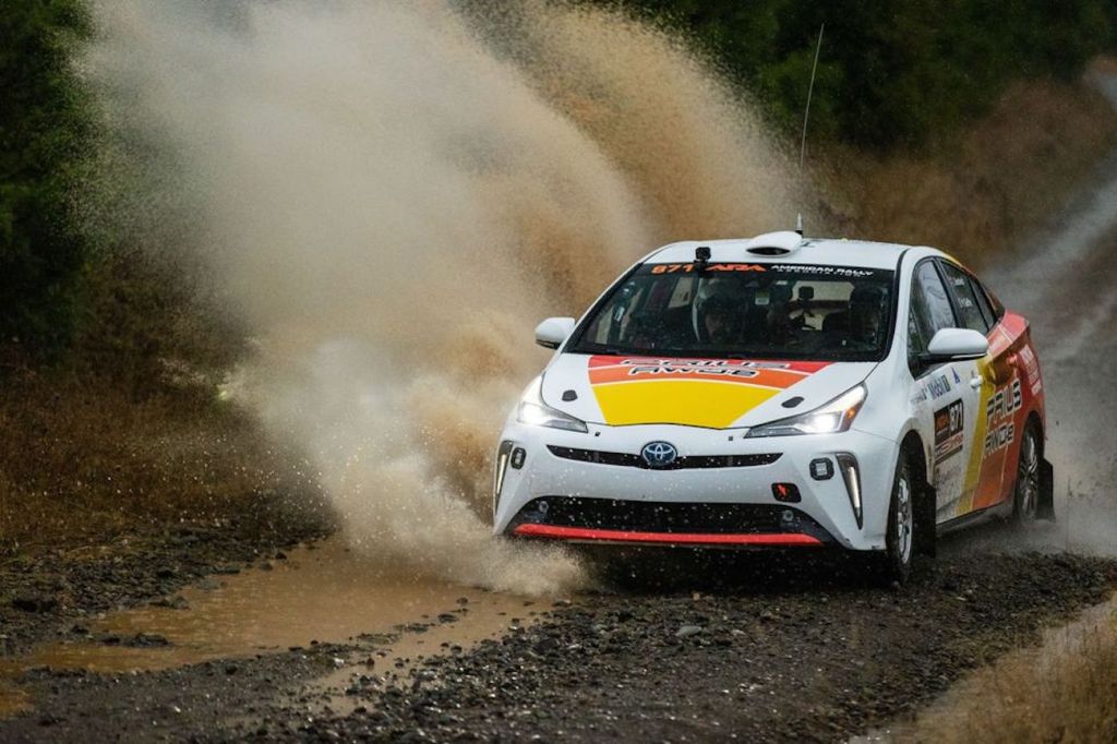 Toyota Prius Rally car ripping through a giant puddle 