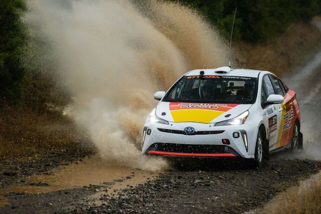 Toyota Prius Rally car ripping through a giant puddle