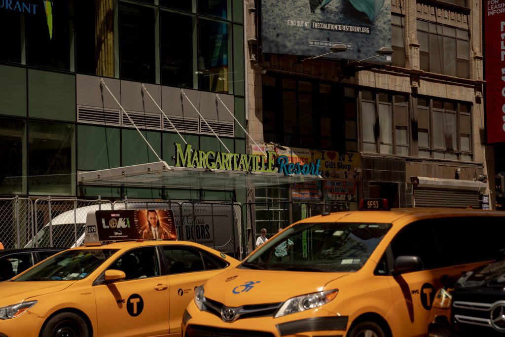 Taxis pass the Margaritaville Resort Times Square during the opening in New York.