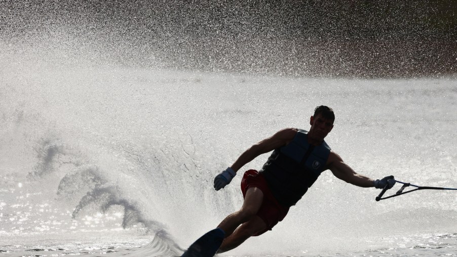 A person water skiing behind a boat in a waterway in Okeeheelee Park on March 26, 2021, in West Palm Beach, Florida