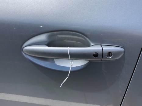You Should Never Do This if You See a Wire Tied to Your Car Door Handle