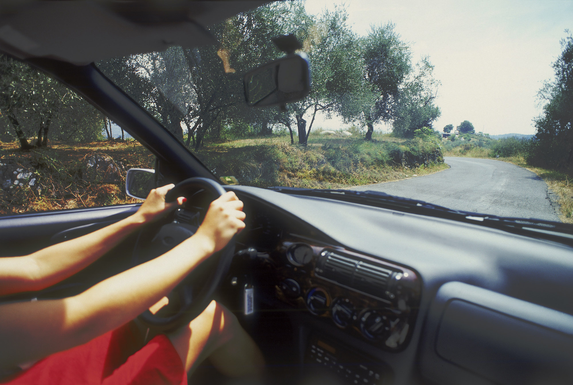 Woman driving an air-conditioned car, Island of Ibiza, Balearic islands, Spain