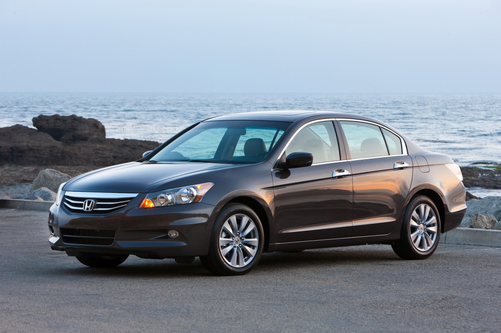 a 2011 Honda Accord parked near the shore in a press photo