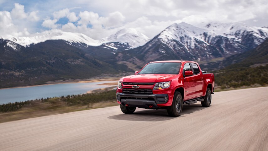 A red 2022 Chevy Colorado Trail Boss driving down the road 