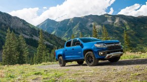 A blue 2022 Chevy Colorado Trail Boss parked on a hill