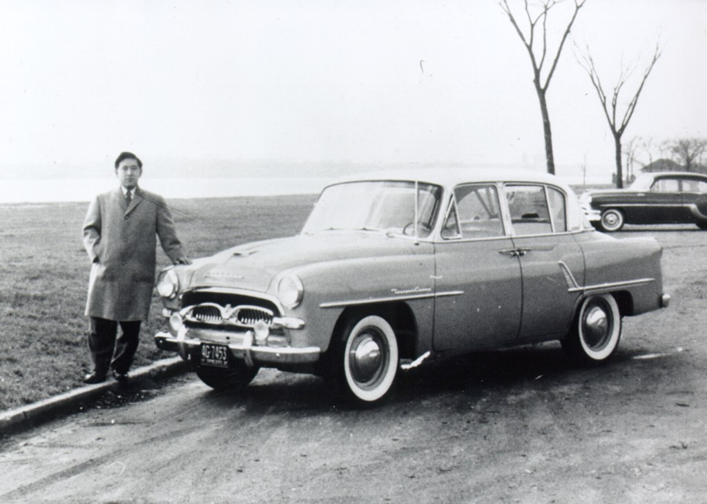 Man standing beside a Toyota Crown