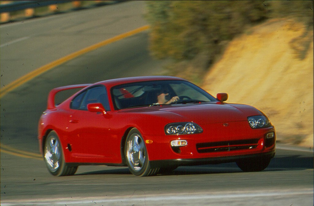 A red Supra on a canyon road in the mid-90s