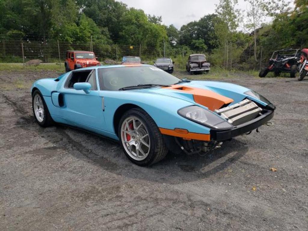 wrecked supercar 2006 Ford GT sitting in an auction lot
