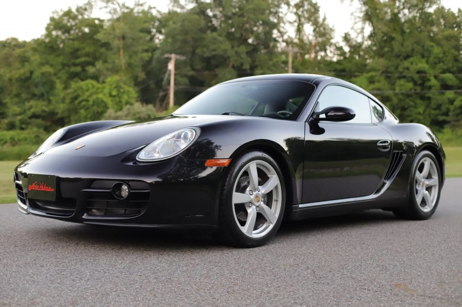 A black 2007 Porsche Cayman 5-Speed in a parking lot