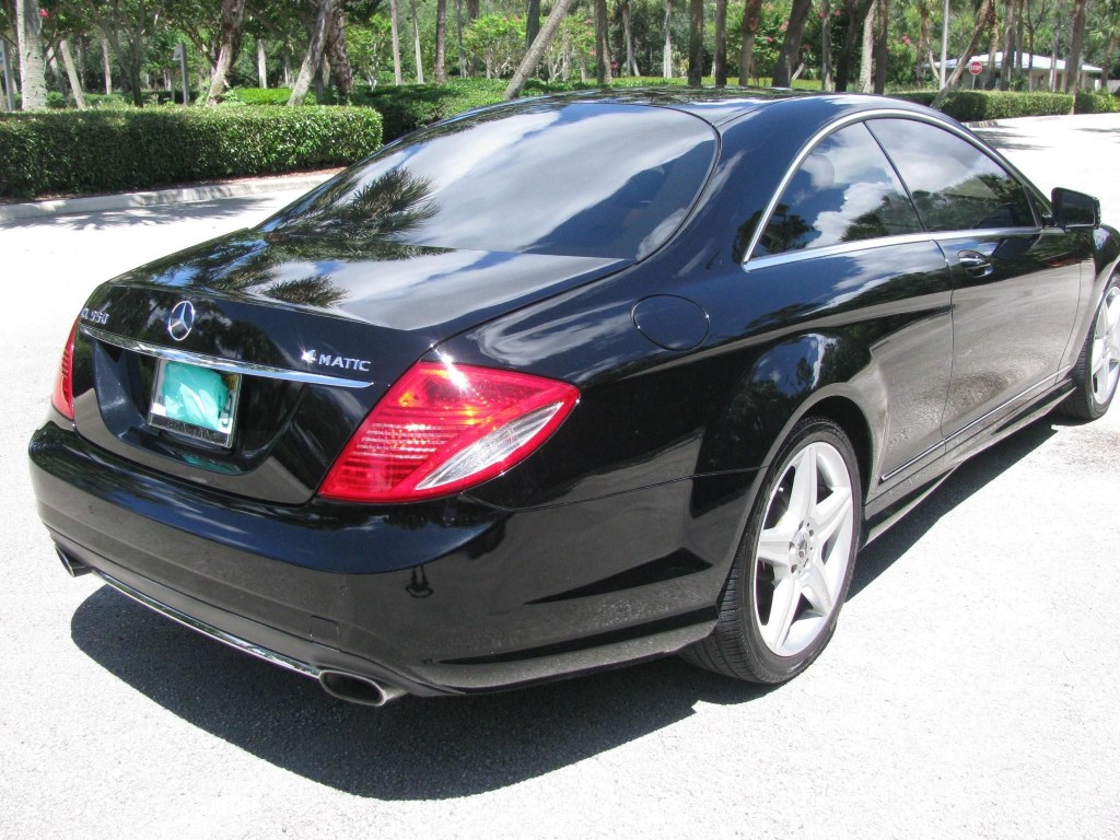 The rear 3/4 view of a black 2010 Mercedes-Benz CL550 4Matic in a parking lot