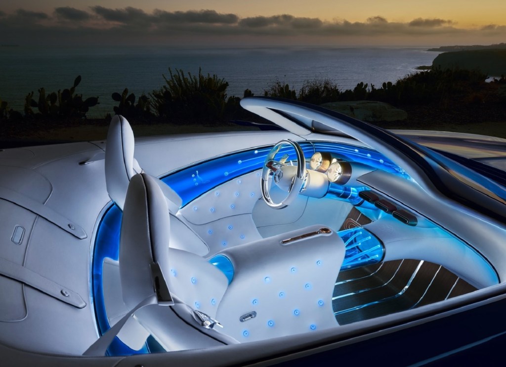 The white-and-blue interior of the 2017 Vision Mercedes-Maybach 6 Cabriolet Concept at night by the ocean