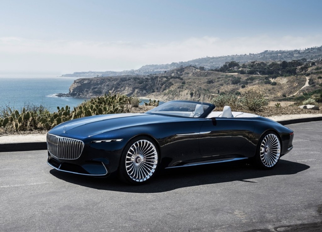 The dark-blue 2017 Vision Mercedes-Maybach 6 Cabriolet Concept on an ocean-side mountain road