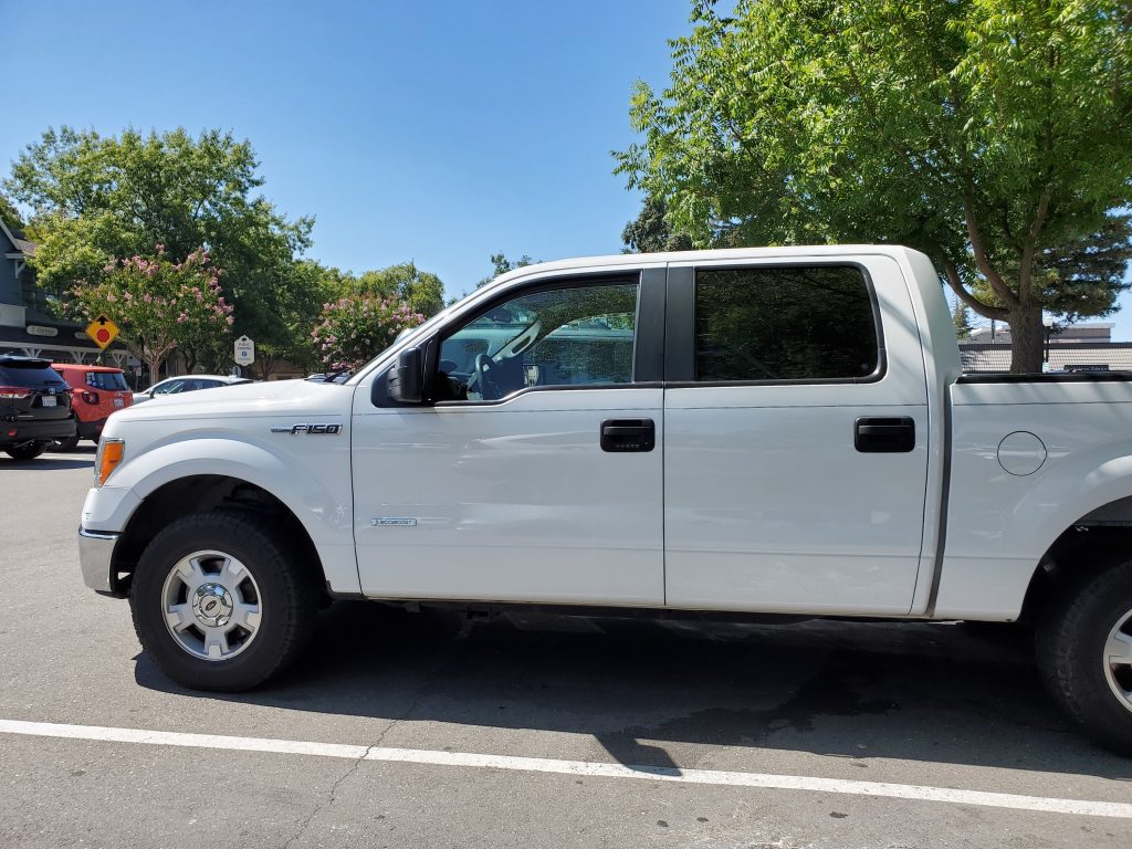 A white Ford F-150 pickup truck