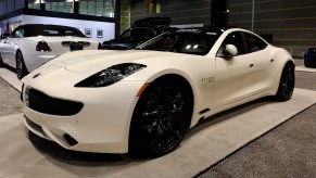 A white Karma Revero sports sedan on display at the Chicago Auto Show at McCormick Place on February 7, 2019