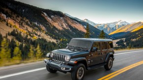 A grey 2020 Jeep® Wrangler Sahara driving, the Wrangler is one of the best used cars of 2021