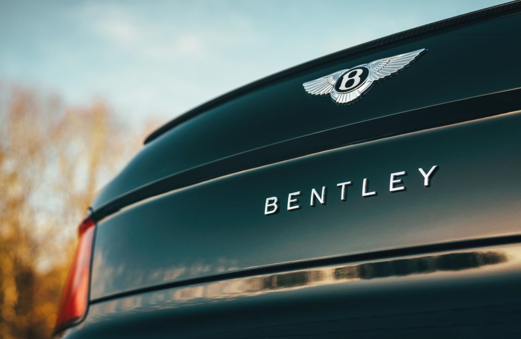 A close-up look at the logo on the trunk of a 2021 Bentley Flying Spur