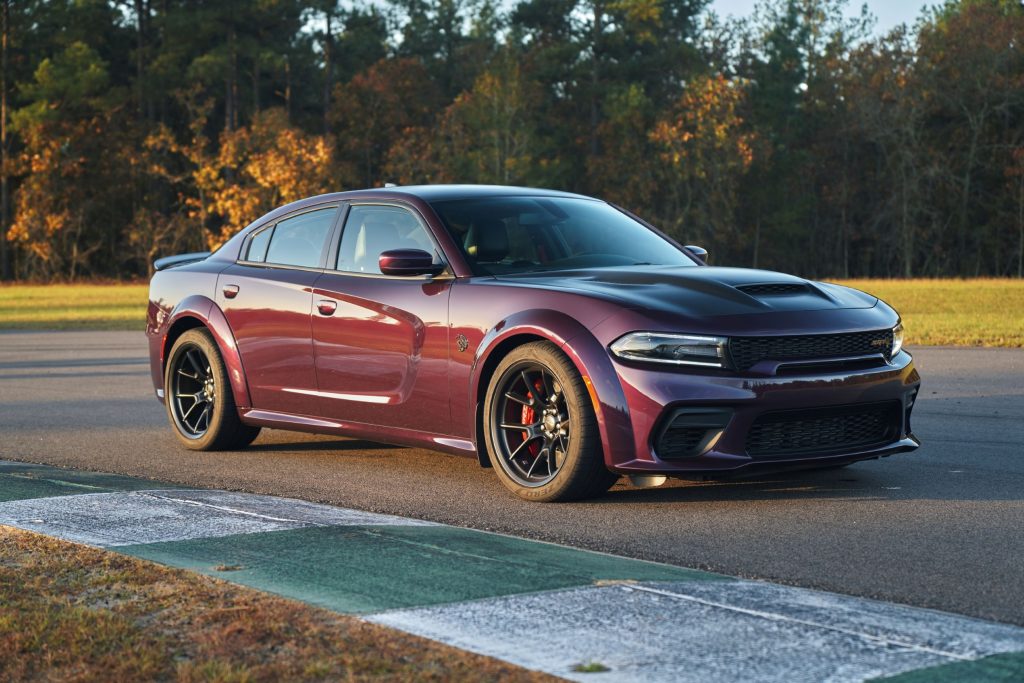 A purple 2021 Dodge Charger Hellcat Redeye Widebody on a racetrack