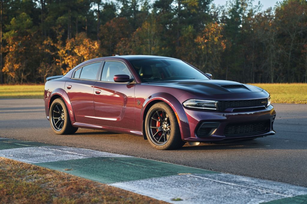 A purple 2021 Dodge Charger Hellcat Redeye Widebody on a racetrack