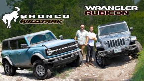 The Throttle House hosts with a blue 2021 Ford Bronco Wildtrak and a silver-gray 2021 Jeep Wrangler Rubicon 4xe on an off-road trail