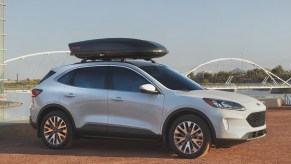 A white 2021 Ford Escape compact SUV parked overlooking a lake