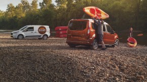 Two 2021 Ford Transit Connect vans next to a body of water