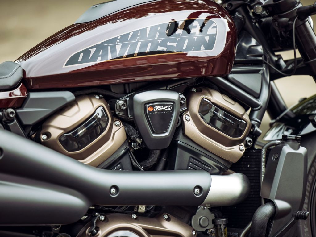 A close-up look at a maroon-and-black 2021 Harley-Davidson Sportster S's engine