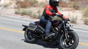 A side 3/4 view of the author riding a maroon 2021 Harley-Davidson Sportster S on the Angeles Crest Highway