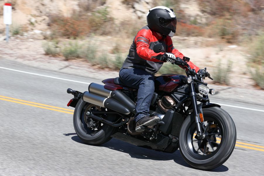 A side 3/4 view of the author riding a maroon 2021 Harley-Davidson Sportster S on the Angeles Crest Highway