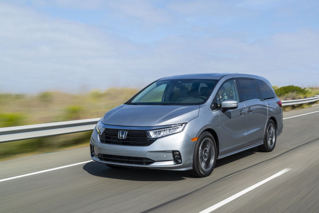 Honda minivan cruising down the highway