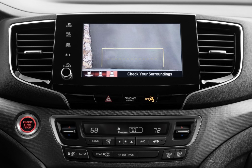 The infotainment screen of a 2021 Honda Ridgeline pickup truck displaying the backup camera function