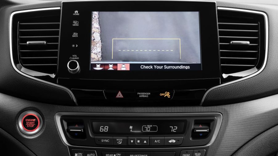 The infotainment screen of a 2021 Honda Ridgeline pickup truck displaying the backup camera function