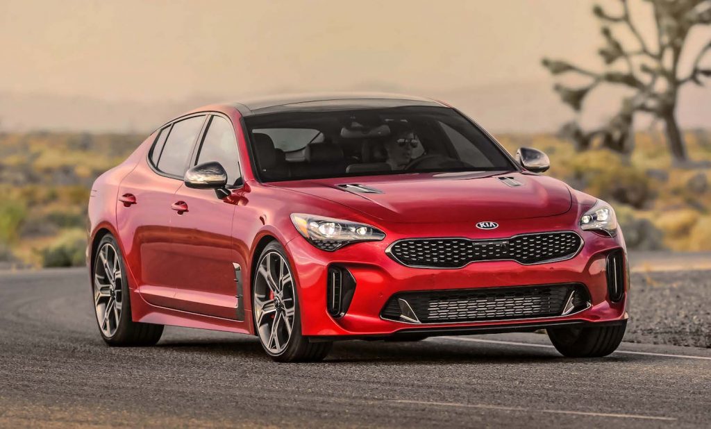A red 2021 Stinger GT2 RWD driving