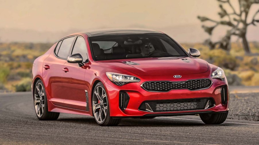A red 2021 Kia Stinger driving