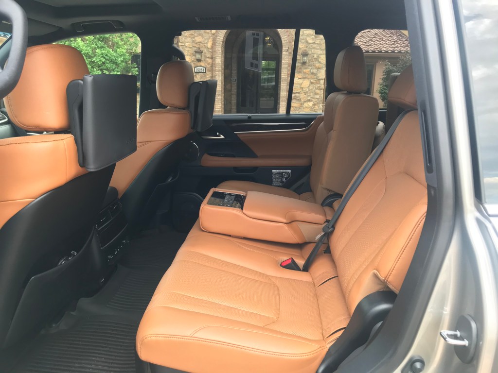 Rear seat shot of the 2021 Lexus LX 570 as it sits in a parking lot driveway for our full review.