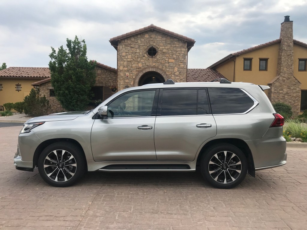 Side shot of the 2021 Lexus LX 570 as it sits in a parking lot driveway for our full review.
