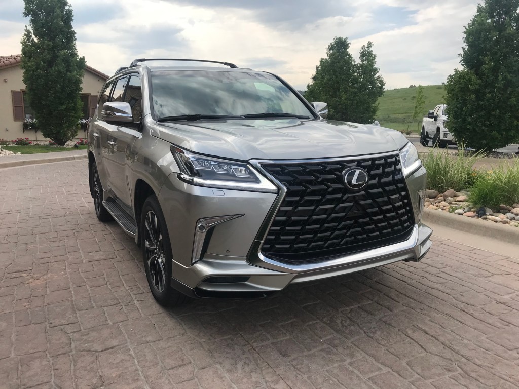 Front three-quarter shot of the 2021 Lexus LX 570 as it sits in a parking lot driveway for our full review.