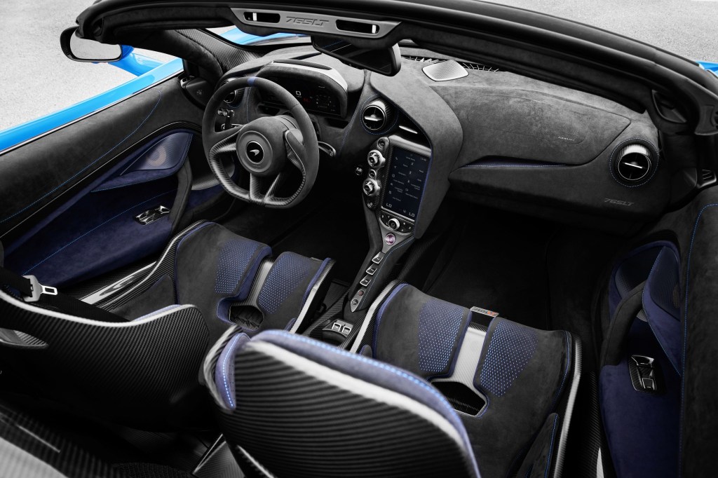 The black-and-blue Alcantara-and-carbon-fiber interior of a blue 2021 McLaren 765LT Spider