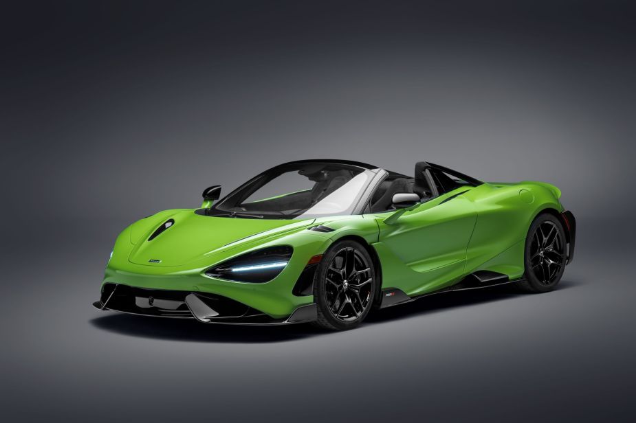 A green and black 2021 McLaren 765LT Spider with the roof down