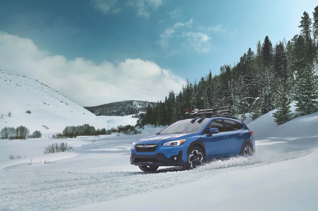 2021 Subaru Crosstrek review shows a blue Crosstrek in the snow
