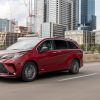 Red 2021 Toyota Sienna Driving Down The Highway