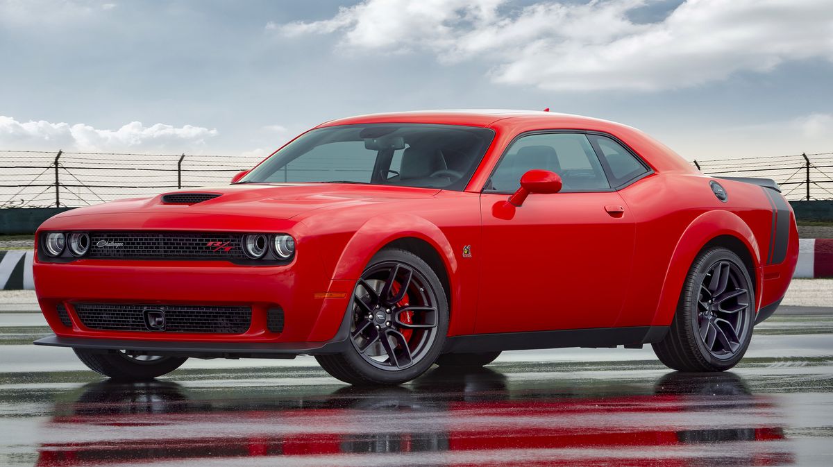 A red 2021 Dodge Challenger parked on the track