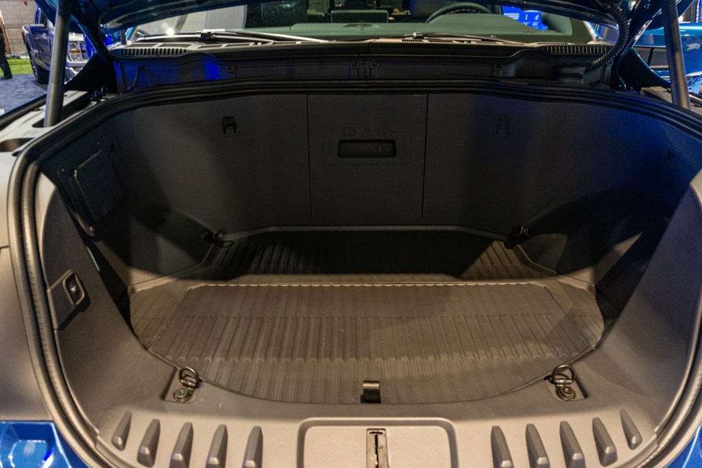 The open frunk of a blue 2022 Ford F-150 Lightning at the 2021 Chicago Auto Show