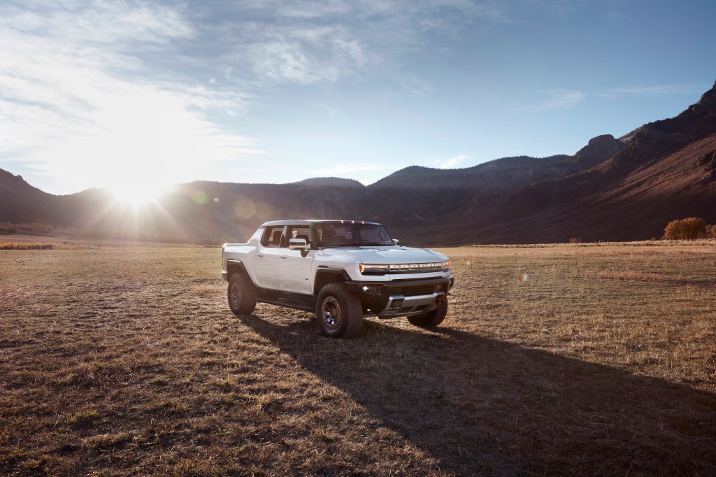 Hummer EV parked in the desert at sunset