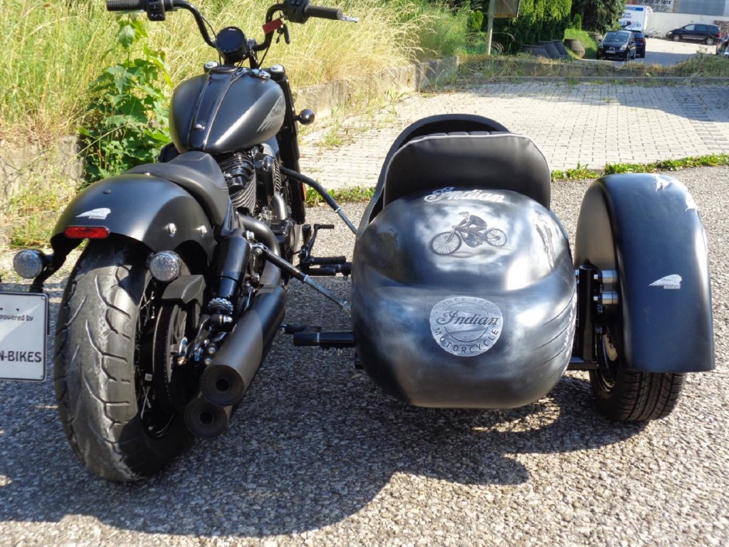 The rear view of a black 2022 Indian Chief Bobber with Iwan Bikes' BellaVista sidecar