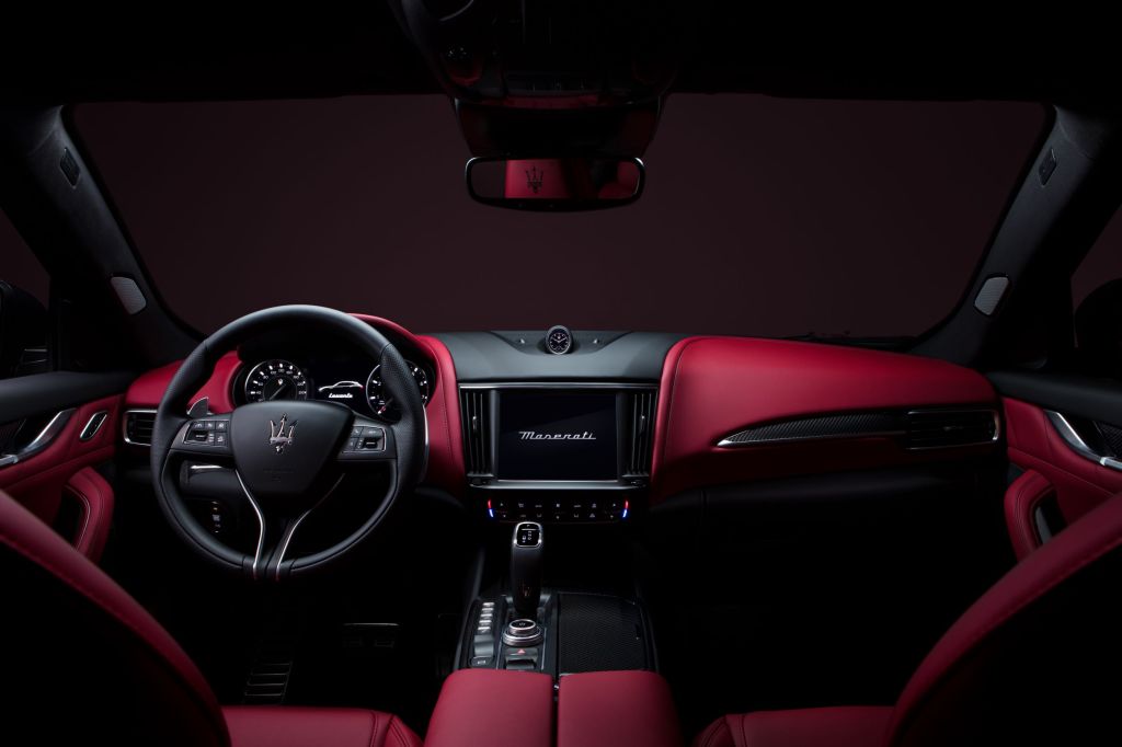 The red-and-black leather front seats and dashboard of the 2022 Maserati Levante Modena SUV