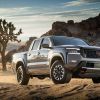 The 2022 Nissan Frontier Pro-4X driving through dirt